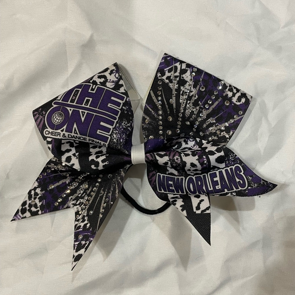 9 inch x 7 inch Purple, Black, & White THE ONE ORLEANS CHEER & DANCE FINALS Bow